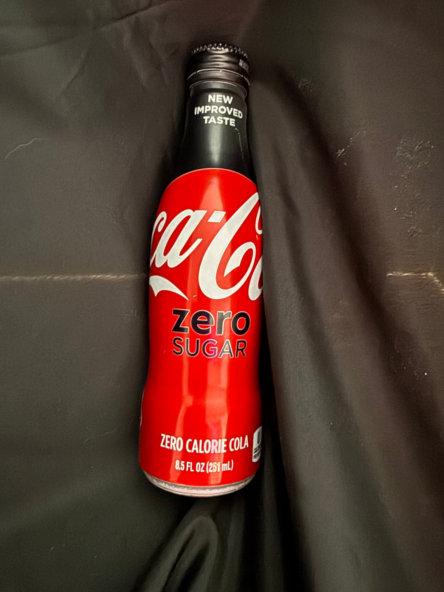 COCA COLA RED/BLACK ALUMINUM BOTTLE SHAPED CAN ZERO SUGAR