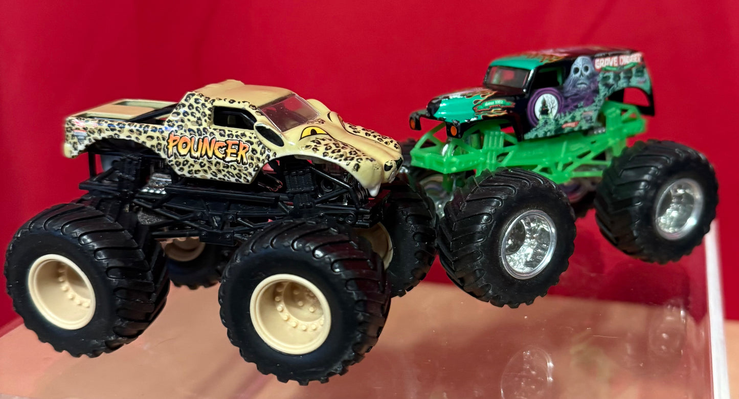 GRAVE DIGGER AND POUNCER HOT WHEELS 4 X 4 TRUCKS